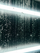 close up of ExoShield ULTRA DIY windshield protection film with water on it.