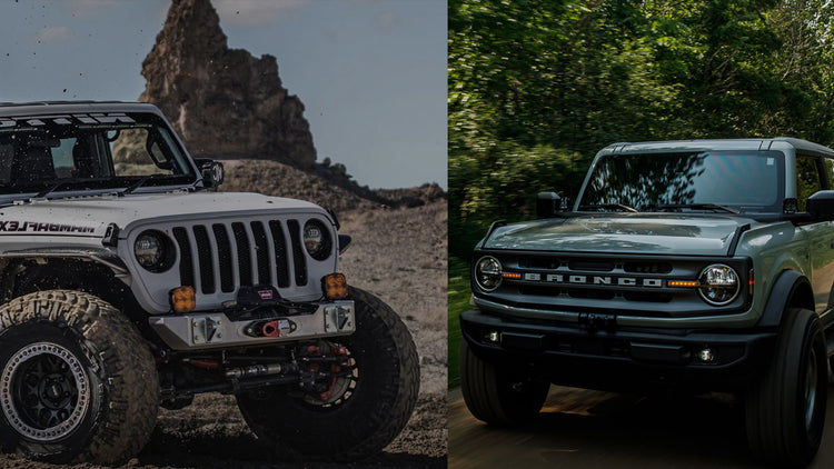 A split-screen comparison showing two SUVs: on the left, a white Jeep Wrangler off-road in a rocky desert setting, and on the right, a dark green Ford Bronco on a forest road.